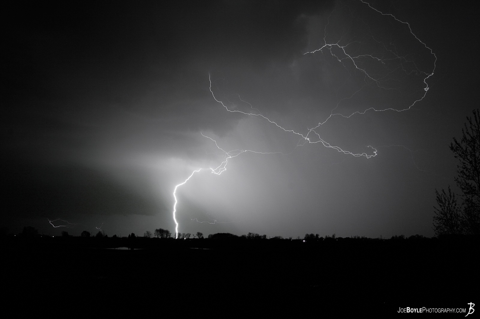  This photo won a "Best Image of the Week Award" for being in the top 20% on Pixoto.com. While I was out at a cabin for a weekend a storm came rolling in on our position and while it was still off in the distance I was able to capture this lightning strike! 