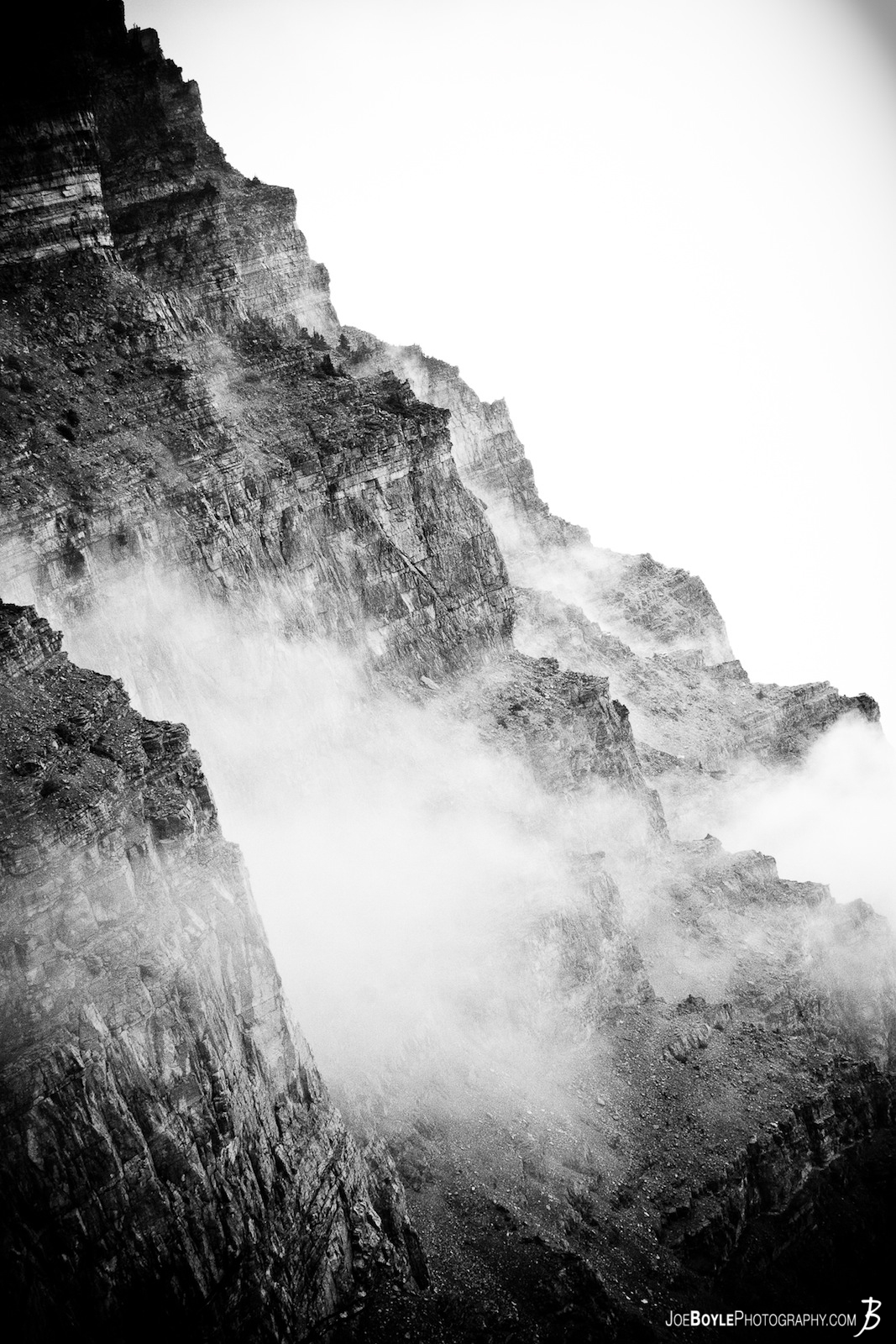  This black & white picture is of "Bear Mountain" located in the beautiful Glacier National Park. Captured with a weather system moving in allowed this image to include clouds beginning to engulf the mountain. 