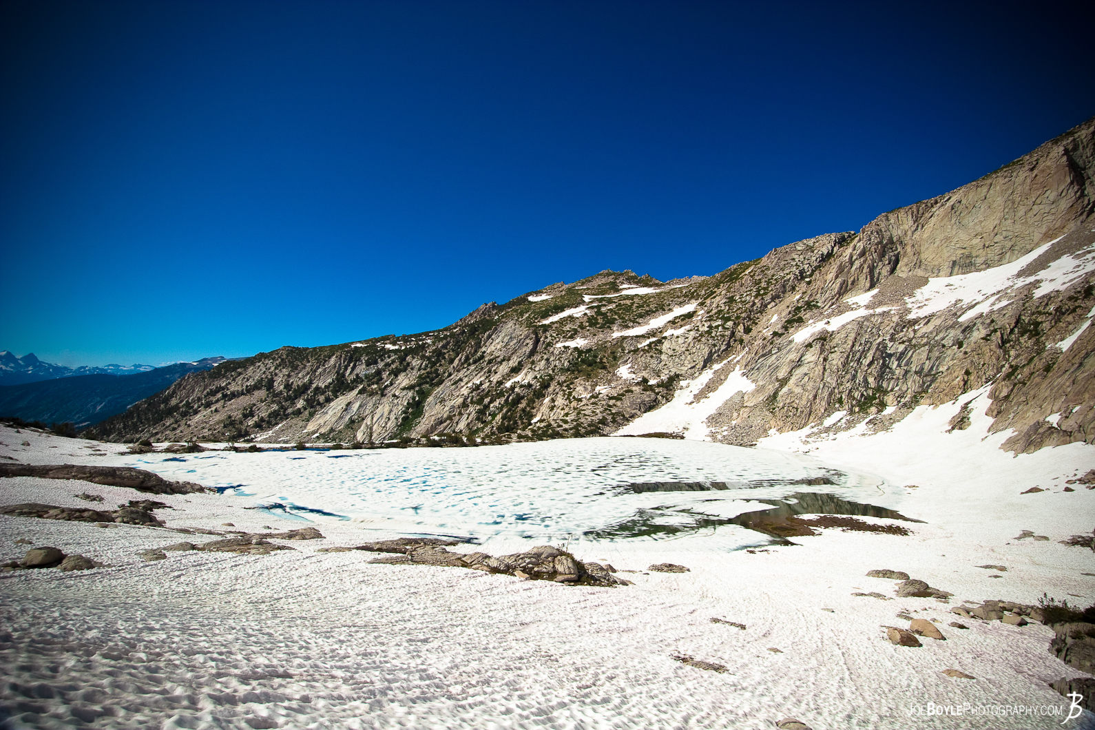  I took this photo as I was hiking the John Muir Trail. There was record snow pack for the year that I went (2011), consequently alot of the nature scenery was loaded with snow! 