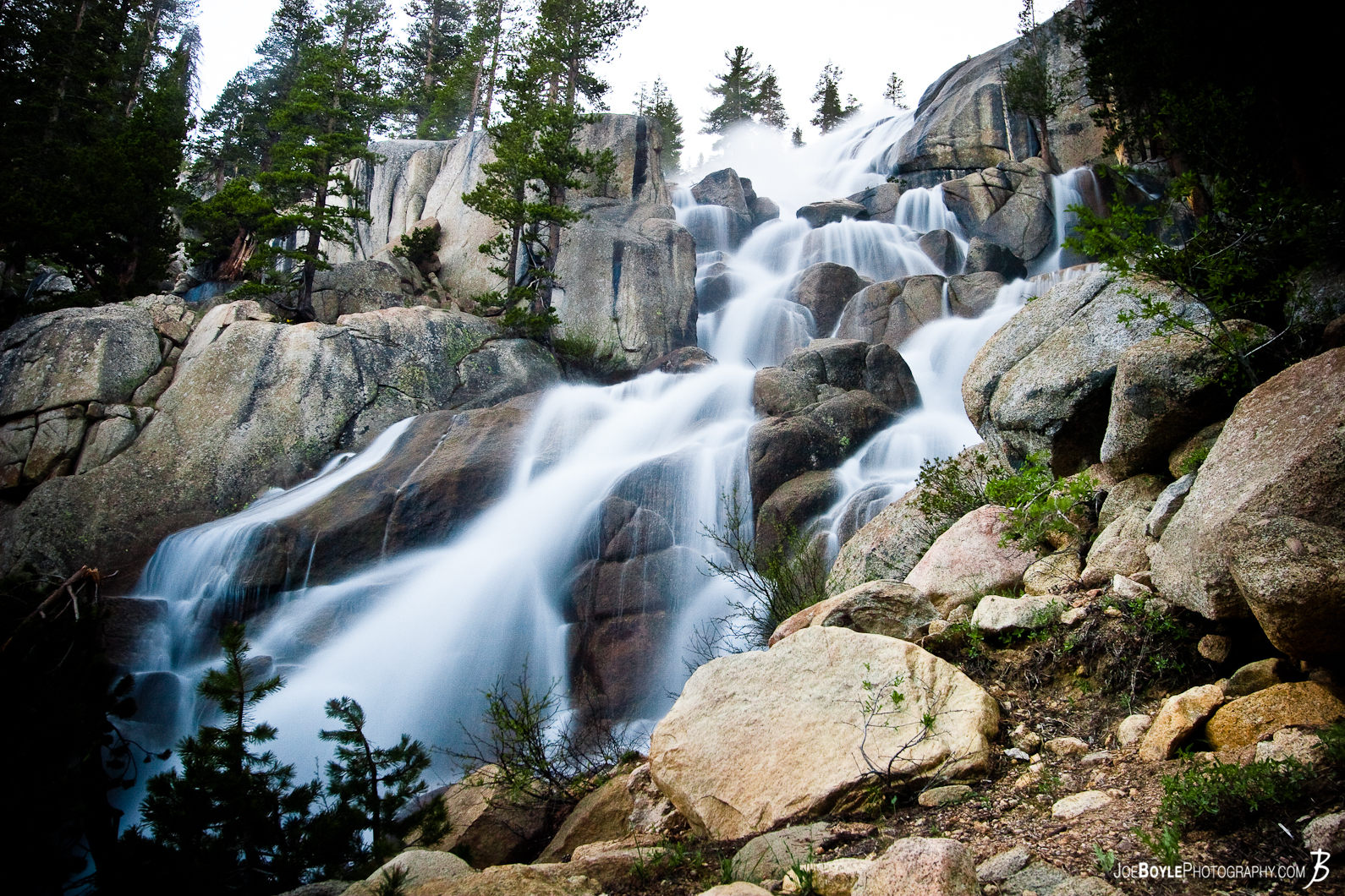  This waterfall scene was taken after a major river crossing on the John Muir Trail. Crossing it, I felt like the river was going to whisk me away which would not have been good! On the opposite side of the waterfall it's a rather steep drop - it would be most painful if not deadly to fall down. I suppose that is strong enough motivation to keep your legs underneath you plus you do a lot of praying in those moments! :) 