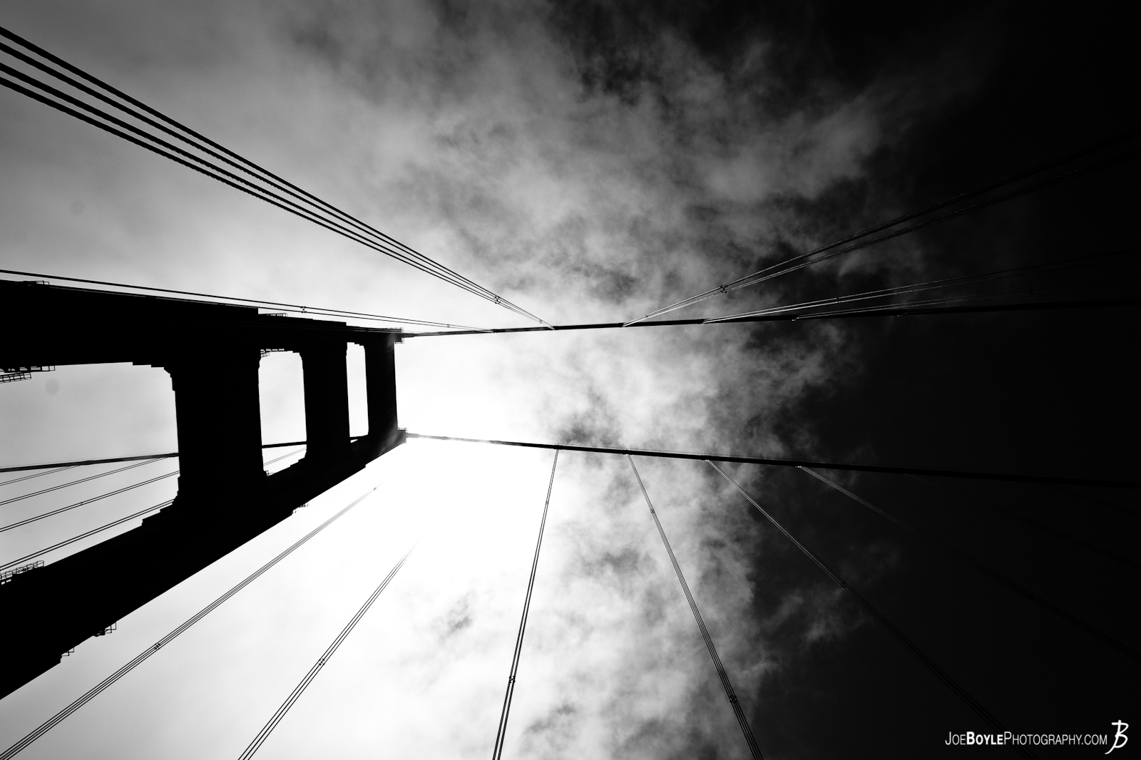  A photo of one of the Golden Gate Bridge towers and cables against the sky. I was walking back and forth on this bridge trying to find new pictures and angles I could capture. Plus, I had to wait around for awhile before I could take, what I would call, "really good pictures", because it was cloudy and dreary for most of the day. 