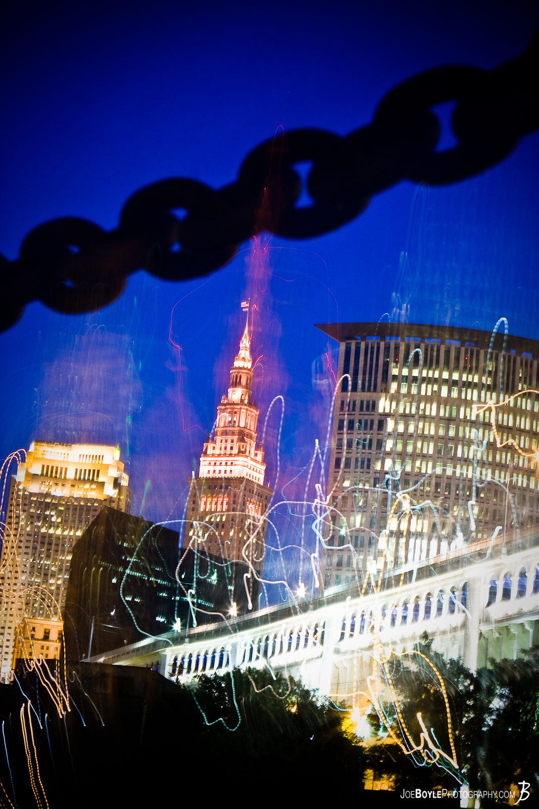  A night photo of the Terminal Tower & Veterans Memorial Bridge. I posted this photo because I thought it looked cool - This is what happens when you drop your camera during a long exposure! The building peaking in on the left is the BP-Huntington building and the building creeping in on the right is the Justice Center. 