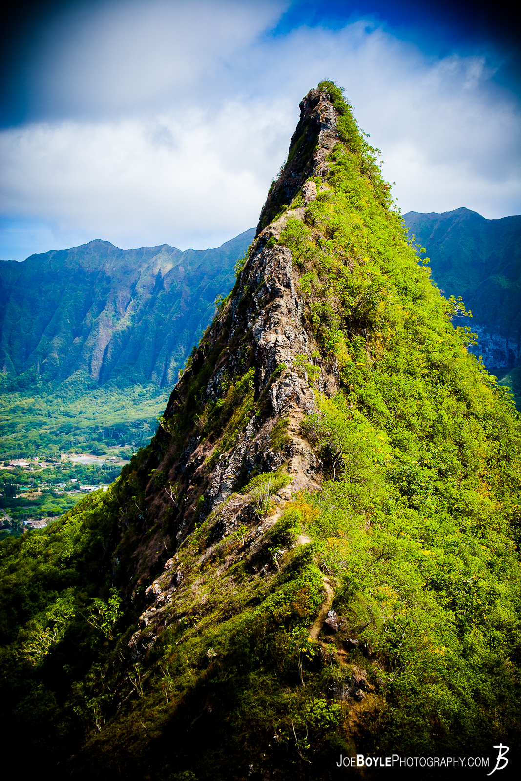  While on a trip to Hawaii I was able to hike the Olomana Trail. This trail is on the island of Oahu. Here is a link for more information if you want to hike it yourself: Olomana Trail The hike was pretty strenuous! There were lots of vertical ascents and descents by rope which had been placed there for the trail or by rock scrambles. Honestly, I didn't trust the rope because I didn't know how often it was checked and maintained so I did as many rock scrambles as I could. But at some points you had to put all your weight on the rope and hope it didn't break because if it did, well, that would be the last of you my friend. Was it worth it? YES!! 