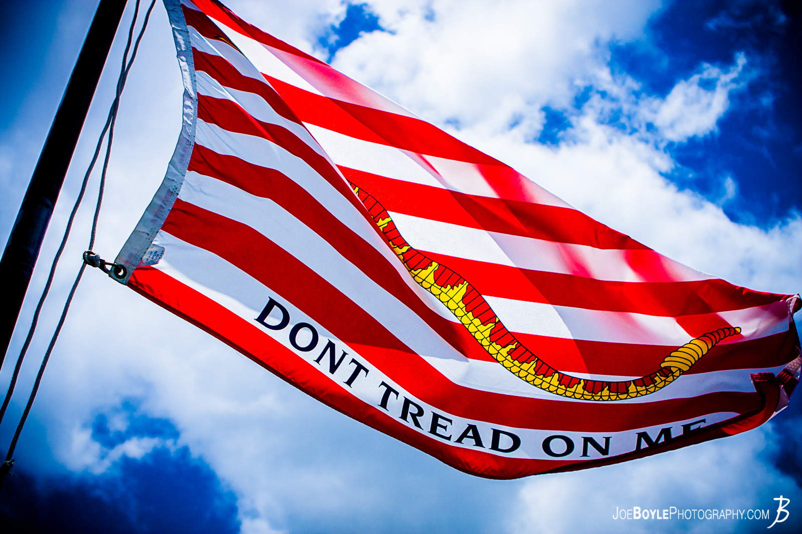  While on a trip to Hawaii I made a visit to Pearl Harbor on Oahu. I was able to capture a photo of the American Flag that now flys aboard this vessel, the U.S.S Bowfin submarine. This vessel lived through a traumatic era of American History and this flag with, "Don't Tread on Me" epitomizes the American attitude during World War II. 