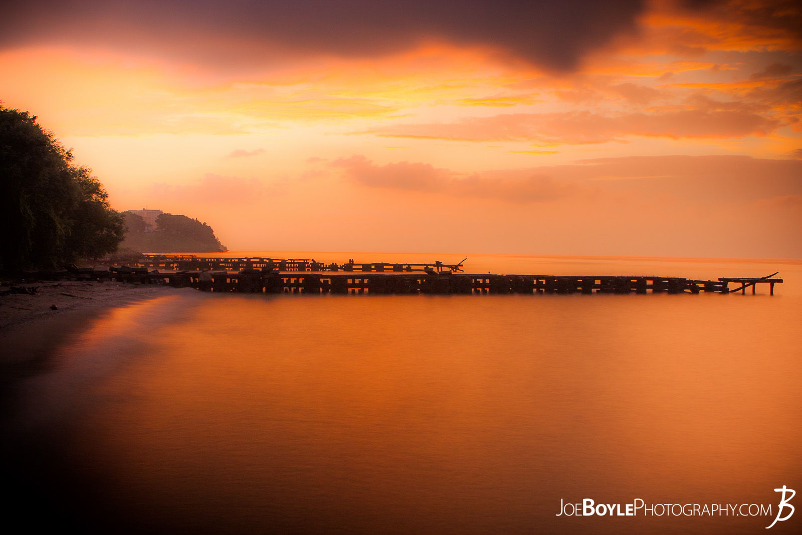  A beautiful sunset off the coast of Lake Erie with a pier in the foreground. This image was captured in Cleveland Ohio, specifically near Edgewater Park. I used a slower shutter speed to achieve the peaceful and serene feel! 