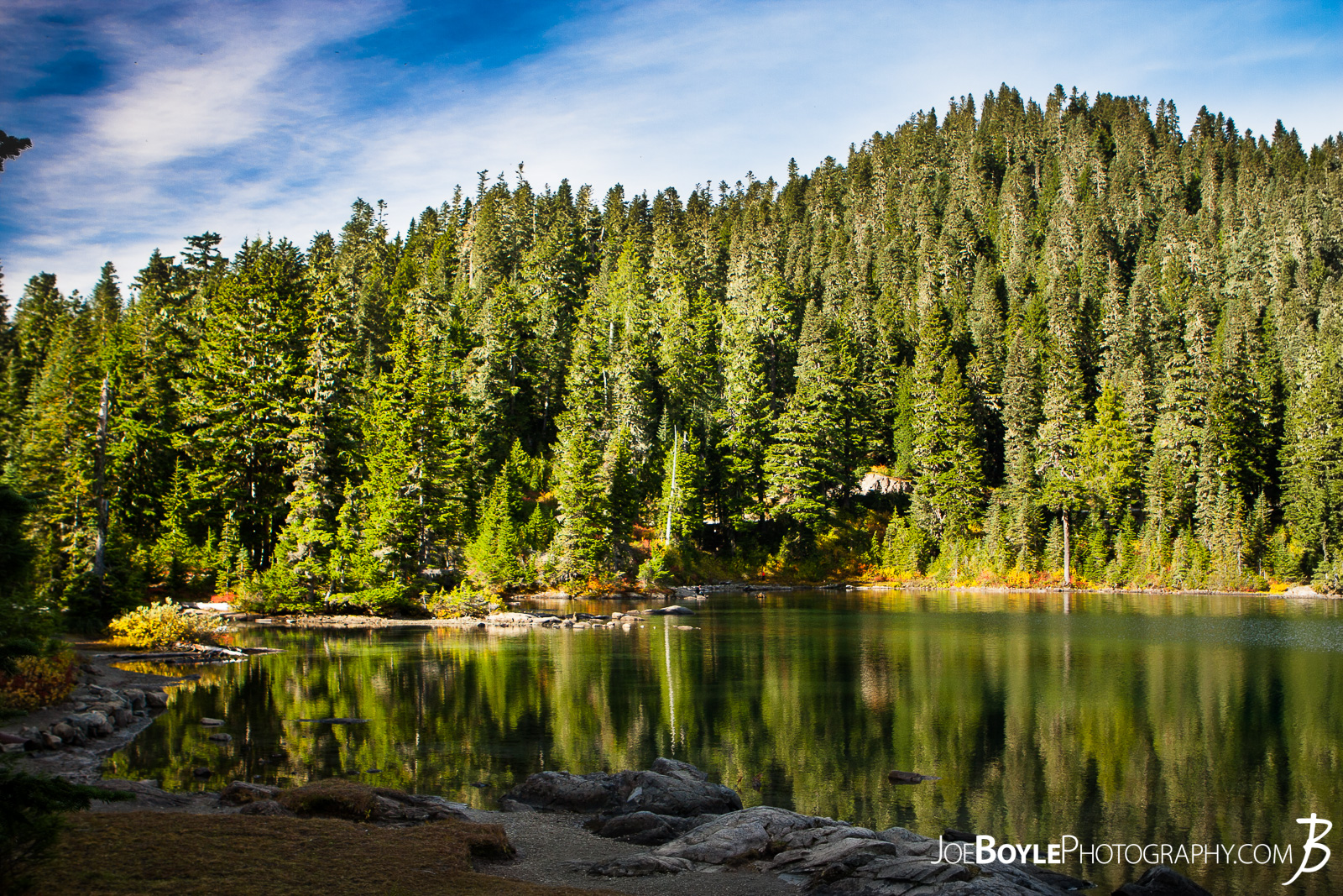  Here is a photo of the shoreline at Mowich Lake. We stayed at the campground that was nearby for the night and picked up our food re-supply stash! Also, as a late night surprise, there was a group of people surveying the land for a University, they introduced themselves to us with left over Chocolate cake that they couldn"t finish. It was delightful! 