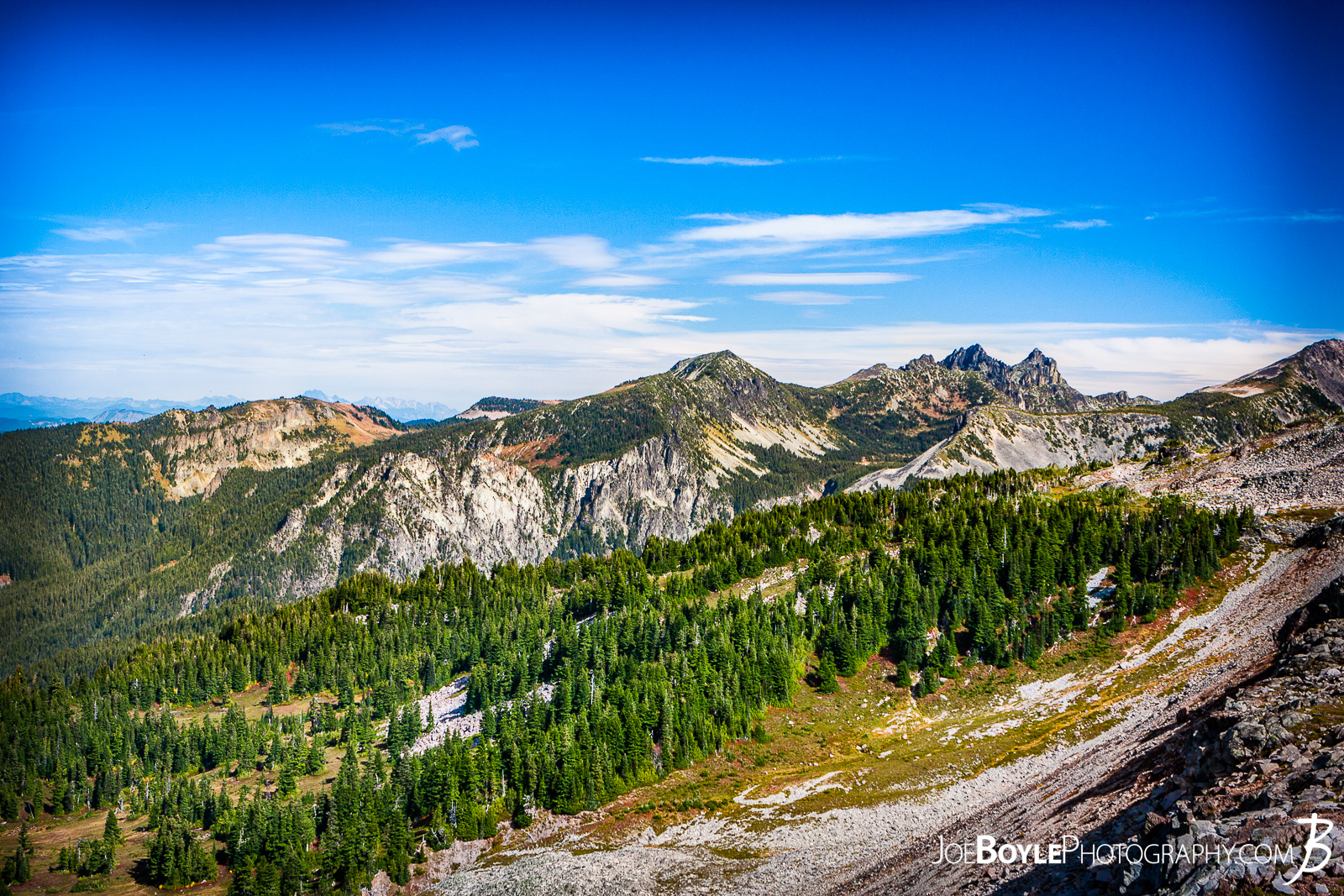 After we left Mowich Lake Campground, my buddy and I decided to take the Spray Park trail instead of the Wonderland Trail Proper. I read in Bette Filley's book, "Discovering The Wonders of the Wonderland Trail" that Spray Park offers some magnificent views whereas the Wonderland Trail is more forested and covered. The only catch is that if it's bad weather, Spray Park is absolutely miserable as there is no cover and it's the highest point on the trail. Thankfully we lucked out and had blue skies and great views! Here is a photo of Mount Pleasant as seen from the Spray Park Trail. 