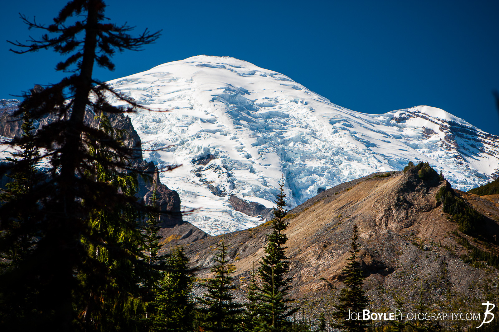  I took this photo of Mount Rainier on our approach to Panhandle Gap. There was a cold breeze and fresh snow on the ground. We were warm when we were walking, but as soon as we stopped for a drink or rest, we became cold. Quickly! 