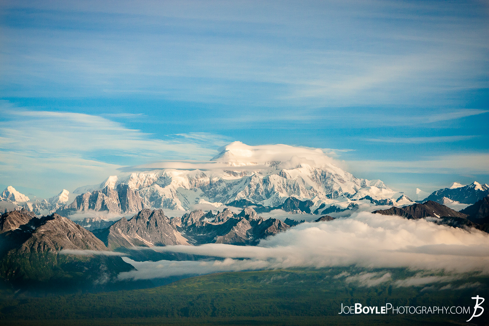  I was thrilled to be able to go to Alaska for some extended backpacking! A good buddy of mine and myself spent 17 days backing and traveling throughout different parks in Alaska. From ridge trails and Denali National Park (formerly McKinley National Park) to Kennicot and Wrangel-St. Elias, we covered a lot of ground in a short time!  I took this photo of Mount Denali at the top of the first steep climb on the Kesugi Ridge Trail! This trail is located in Denali State Park which is just an hour or two south of Denali National Park! This trail offered some fantastic views of Mt. Denali and the surrounding mountains, forests and meadows! We spent 2 nights on this trail and it was a lot of fun! The landscape was always changing as we hiked up the mountain, onto the ridge and back down again! 
