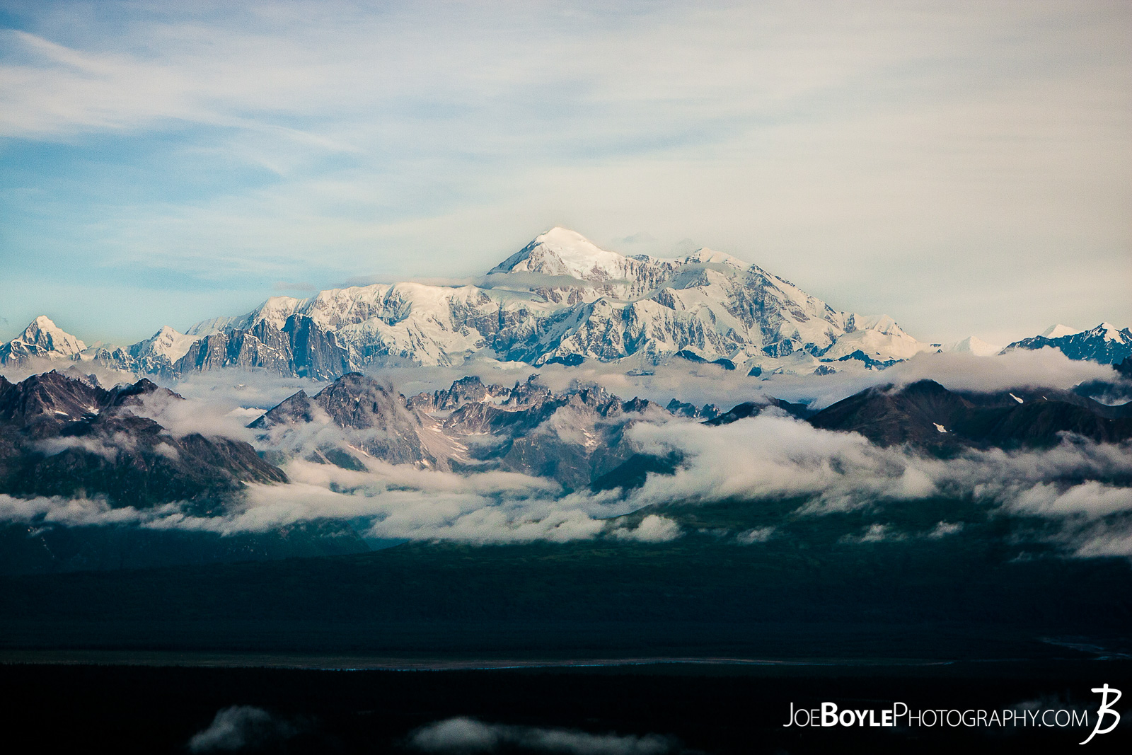  I was thrilled to be able to go to Alaska for some extended backpacking! A good buddy of mine and myself spent 17 days backing and traveling throughout different parks in Alaska. From ridge trails and Denali National Park (formerly McKinley National Park) to Kennicot and Wrangel-St. Elias, we covered a lot of ground in a short time!  I took this photo of Mount Denali at the top of the first steep climb on the Kesugi Ridge Trail! This trail is located in Denali State Park which is just an hour or two south of Denali National Park! This trail offered some fantastic views of Mt. Denali and the surrounding mountains, forests and meadows! We spent 2 nights on this trail and it was a lot of fun! The landscape was always changing as we hiked up the mountain, onto the ridge and back down again! 