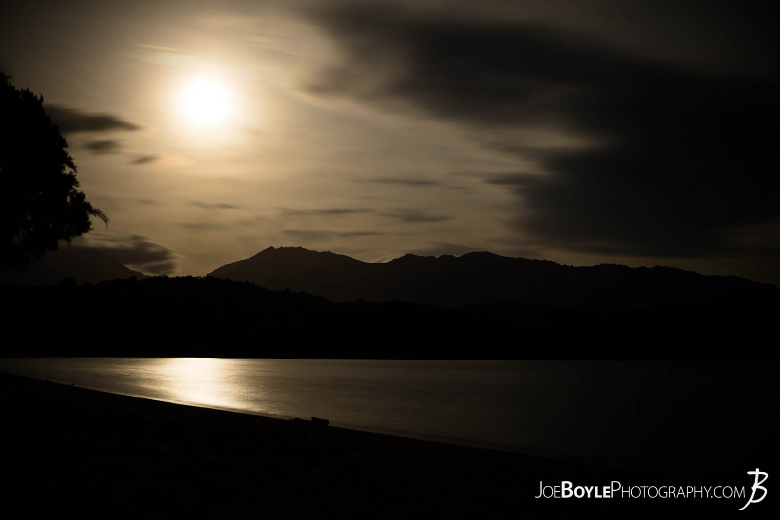  Here is a night-shot of the moon over the mountains with some cool clouds! I was backpacking/camping on the Kepler Track in New Zealand and I had to wake up in the middle of the night to pee! :) You know that feeling when you don't want to get out of your tent and you hold it as long as you can! Once I finally got out I was really excited to see this scene! Honestly, I was hoping for something like this! So I got the camera out and my little tripod and got to work! It was a little chilly so I did some jumping jacks and runs on the beach between shots. :) 