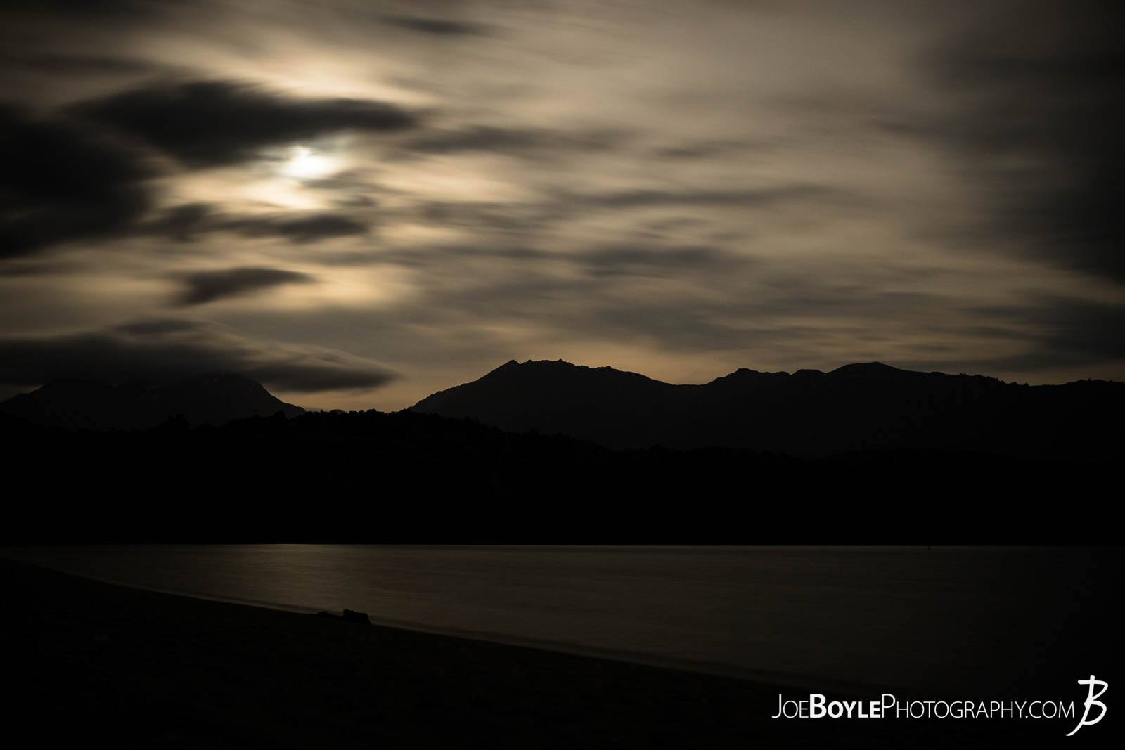  Here is a long exposure night-shot of the moon over the mountains with some cool clouds! I was backpacking/camping on the Kepler Track in New Zealand and I had to wake up in the middle of the night to pee! :) You know that feeling when you don't want to get out of your tent and you hold it as long as you can! Once I finally got out I was really excited to see this scene! Honestly, I was hoping for something like this! So I got the camera out and my little tripod and got to work! It was a little chilly so I did some jumping jacks and runs on the beach between shots. :) 