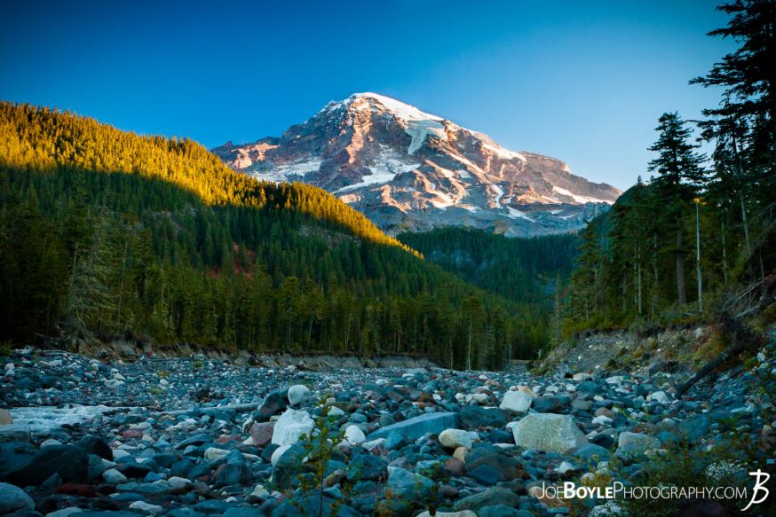 Mount Rainier Sunrise from the Paradise River crossing on The Wonderland Trail. We were on our way out of the Paradise River Campground and en route to the Longmire Trailhead. Mount Rainier Sunrise from the Paradise River crossing on The Wonderland Trail. We were on our way out of the Paradise River Campground and en route to the Longmire Trailhead.