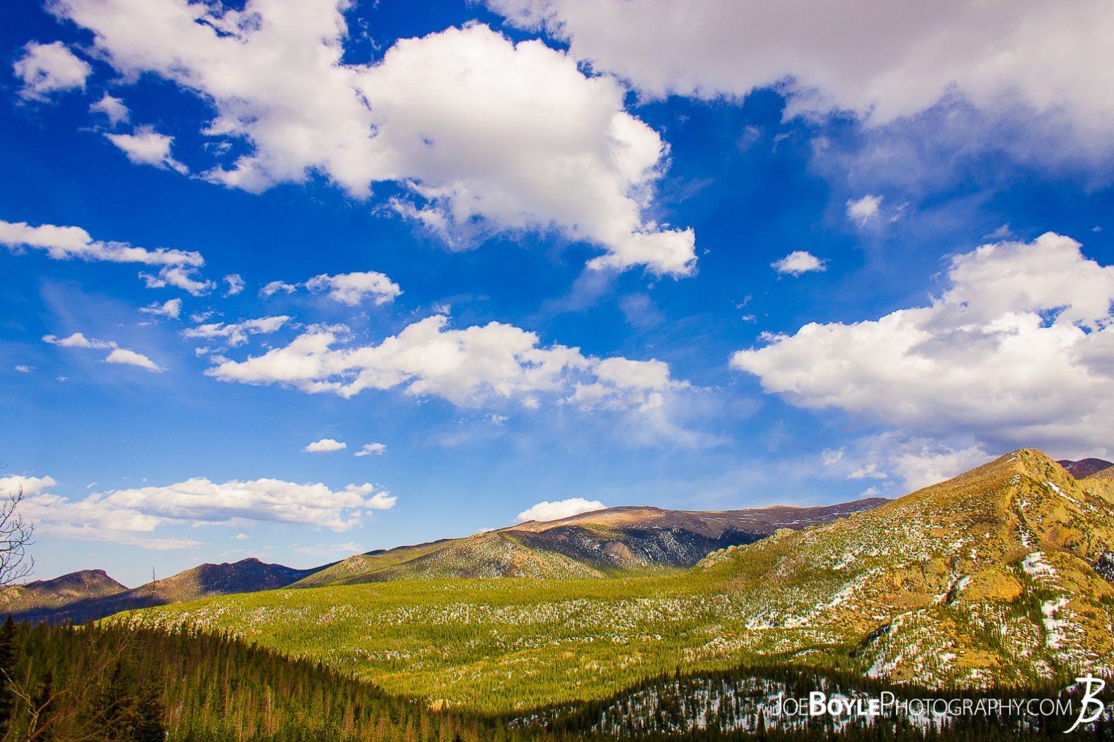 rocky-mountain-range-green-hillside
